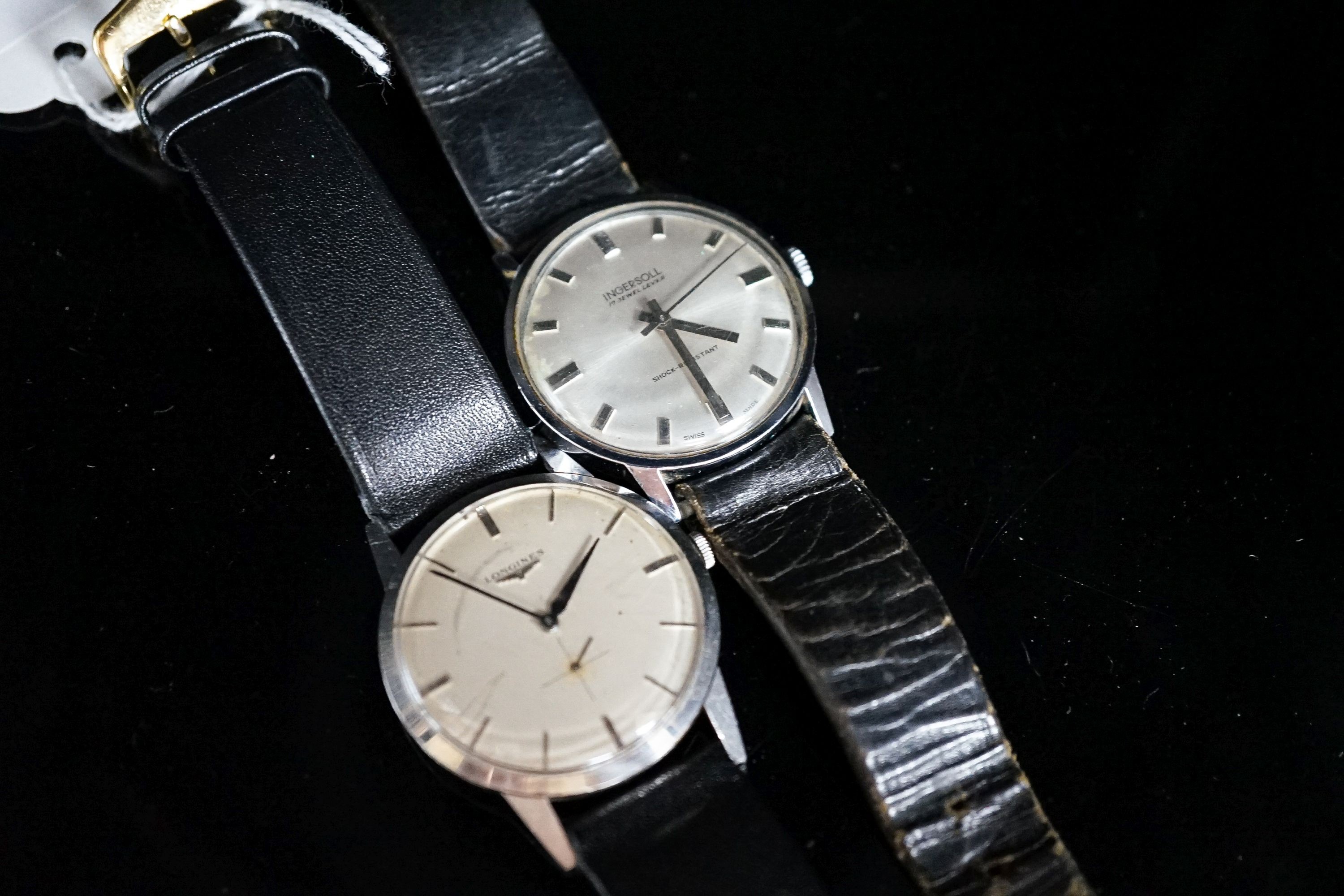 A gentleman's stainless steel Longines manual wind wrist watch, cased diameter 35mm and a similar Ingersol watch.